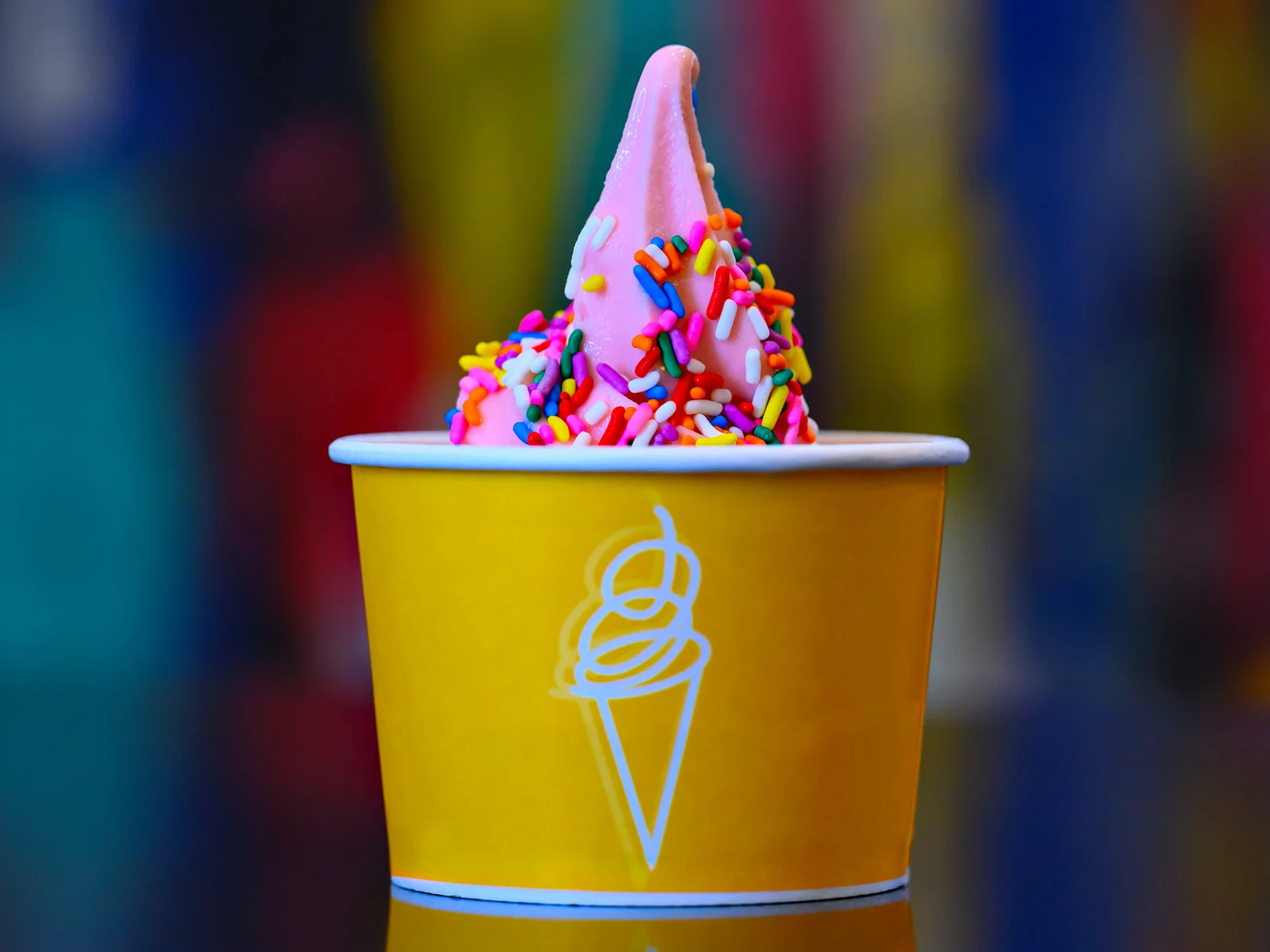 Strawberry Ice Cream with Sprinkles in a Paper Cup