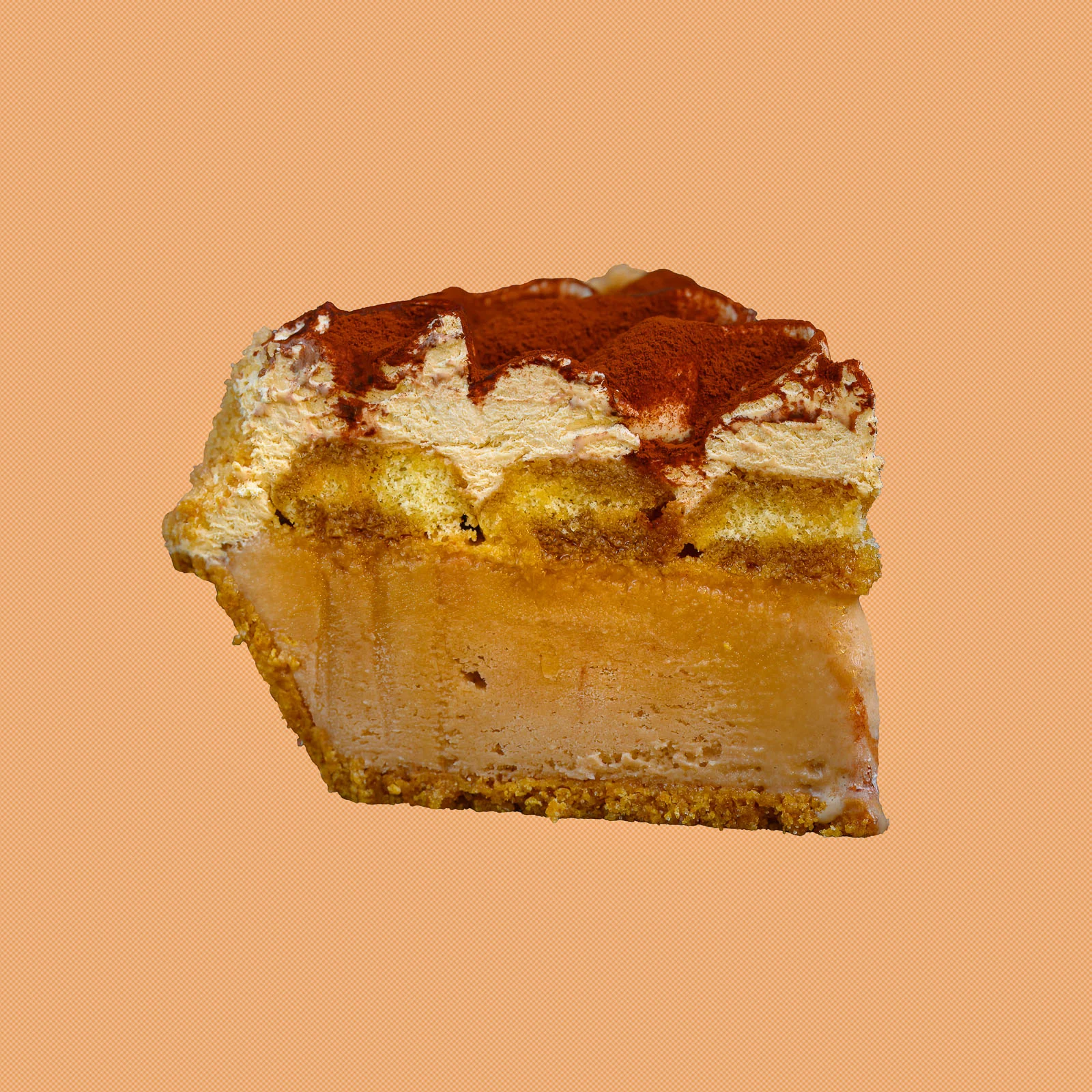 Softserve Pie slice with caramel-colored filling and a dusted topping on a peach background