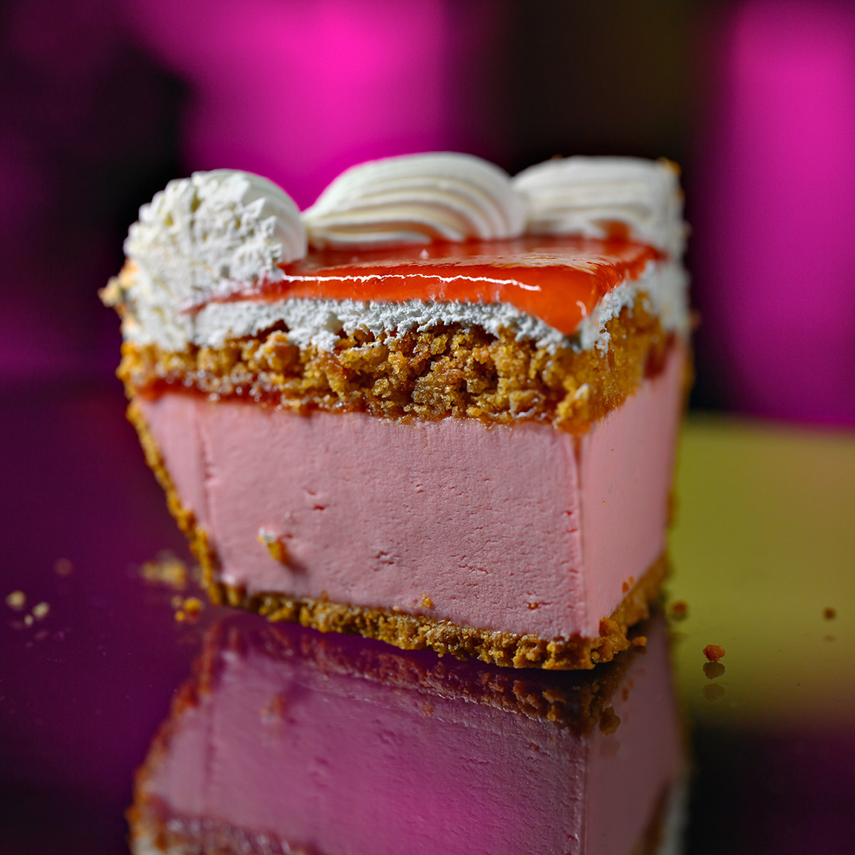 Slice of soft serve pie with pink filling and crumb crust